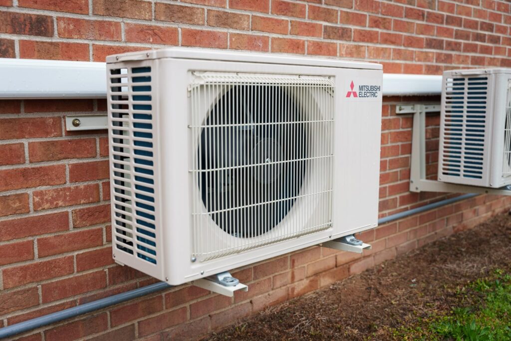 - 2nd Wind HVAC A Mitsubishi Electric Heat Pump installed on the exterior of a building